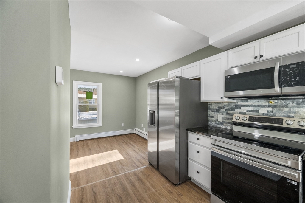 5 Lombard Avenue Athol, MA 01331 - Photo 11 of 40 a kitchen with stainless steel appliances a stove microwave and refrigerator