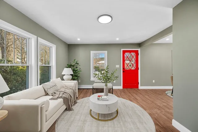 a spacious bedroom with a bed and a couch