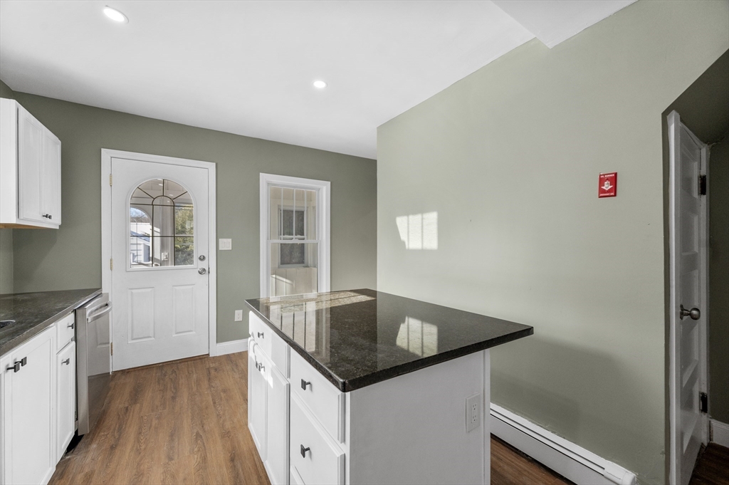 5 Lombard Avenue Athol, MA 01331 - Photo 9 of 40 a kitchen with granite countertop a sink and dishwasher with wooden floor