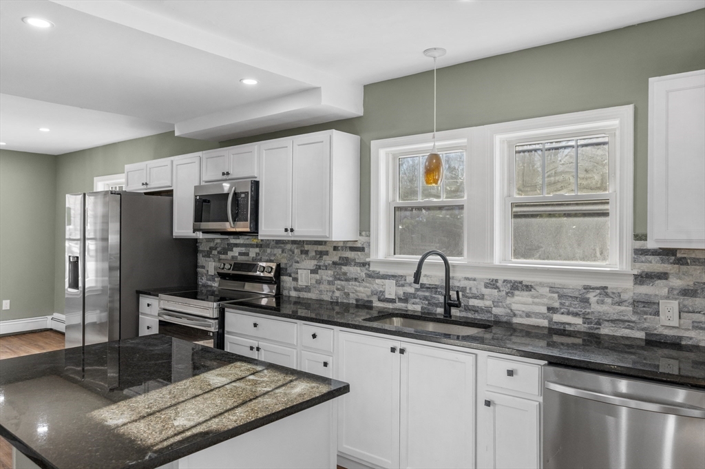 5 Lombard Avenue Athol, MA 01331 - Photo 10 of 40 a kitchen with stainless steel appliances granite countertop a sink stove and refrigerator