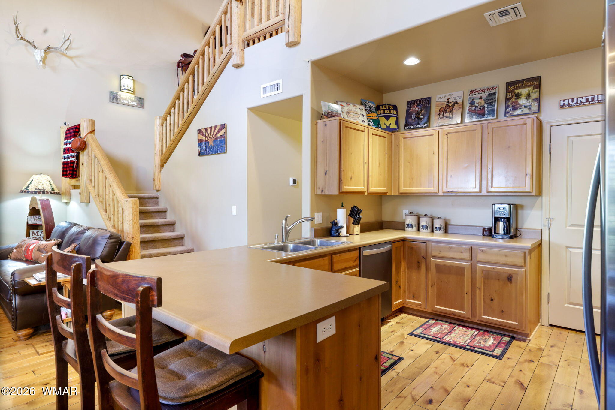 6998 Starlight Ridge Road, Unit LOT 36 Lakeside, AZ 85929 - Photo 2 of 27 a large kitchen with a table and chairs
