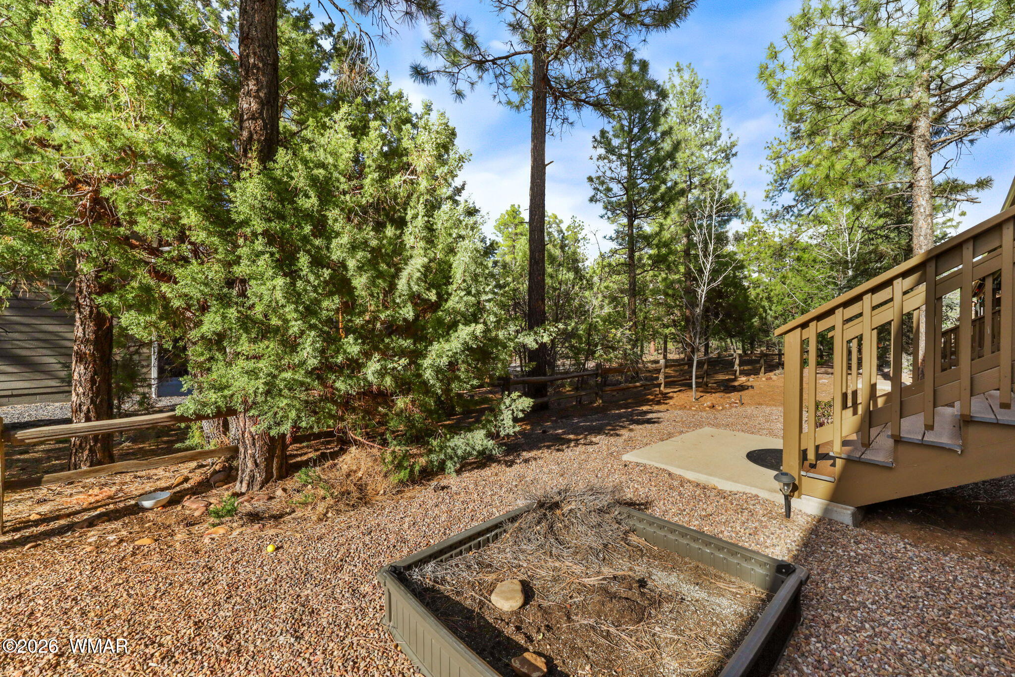 6998 Starlight Ridge Road, Unit LOT 36 Lakeside, AZ 85929 - Photo 22 of 27 a view of a yard with wooden fence