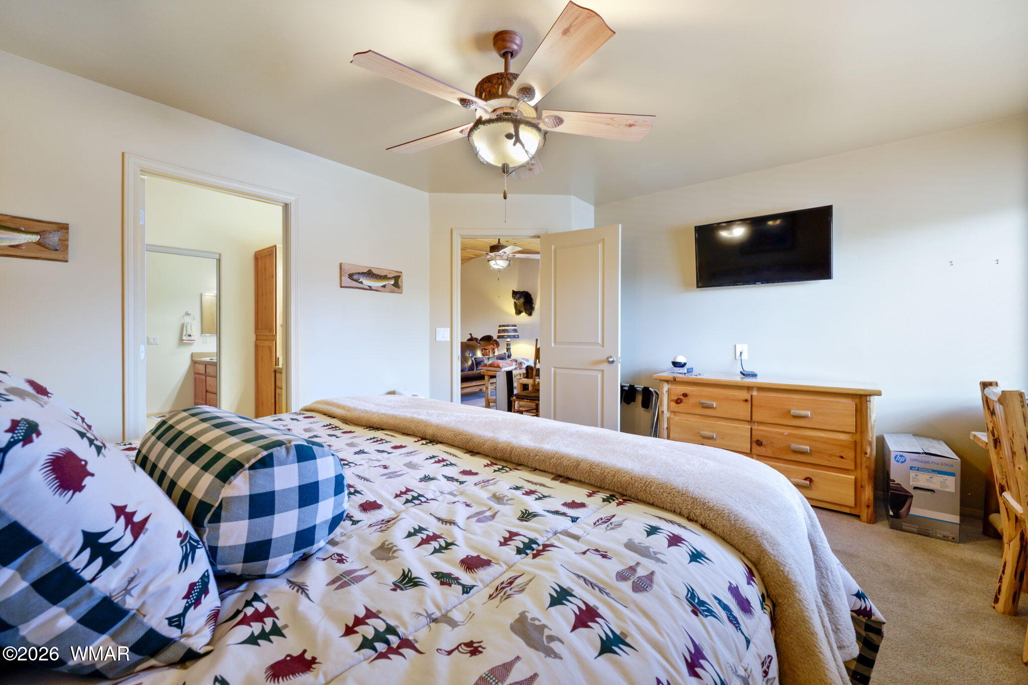 6998 Starlight Ridge Road, Unit LOT 36 Lakeside, AZ 85929 - Photo 8 of 27 a bedroom with a bed a couch and a flat screen tv