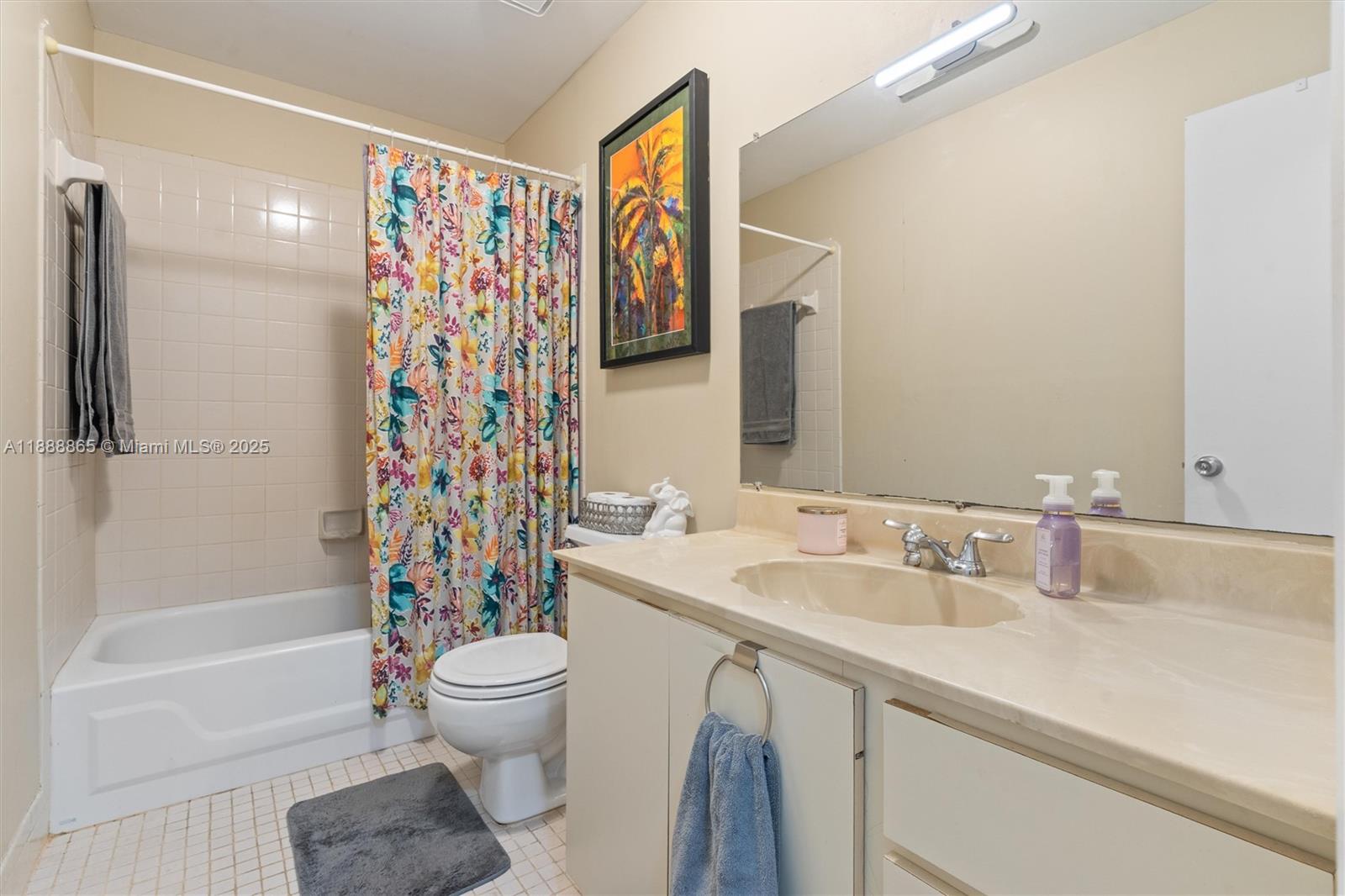 6710 South Parkway Drive, Unit 311 Margate, FL 33068 - Photo 21 of 31 a bathroom with a sink a toilet and shower
