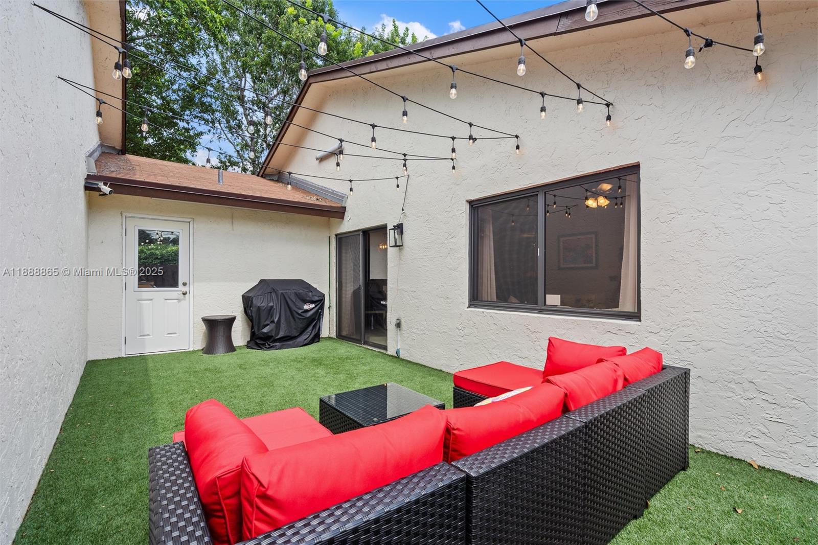 6710 South Parkway Drive, Unit 311 Margate, FL 33068 - Photo 24 of 31 a view of yard with seating area and furniture