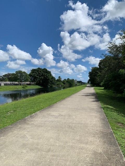 6710 South Parkway Drive, Unit 311 Margate, FL 33068 - Photo 29 of 31 a view of a garden with a lake
