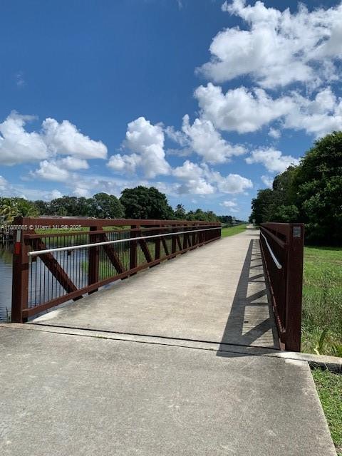 6710 South Parkway Drive, Unit 311 Margate, FL 33068 - Photo 30 of 31 a view of terrace with wooden fence