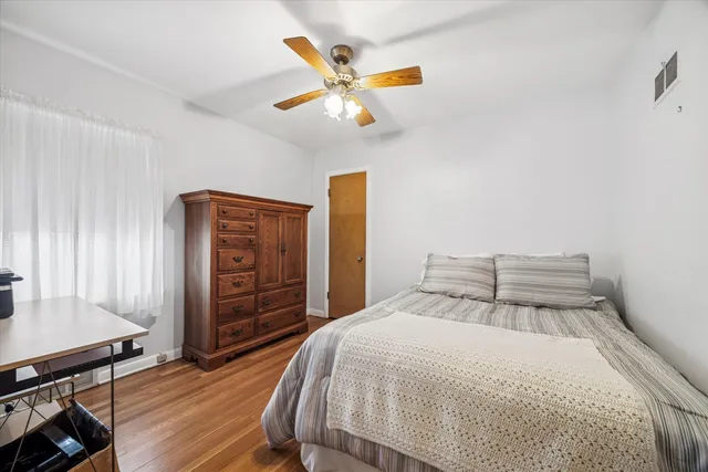 a bedroom with a bed and a table