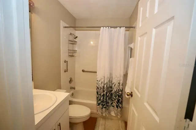 a bathroom with a toilet a sink and bathtub