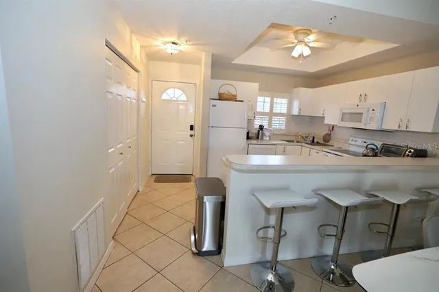 a kitchen with stainless steel appliances granite countertop a sink and cabinets