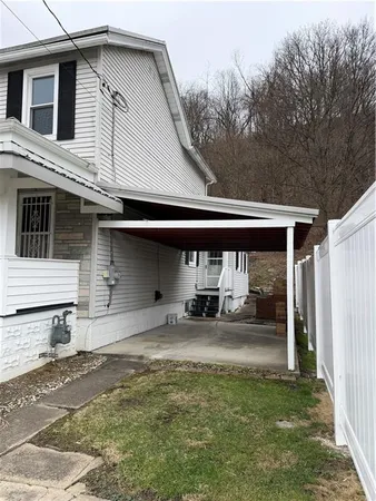 a front view of a house with garage