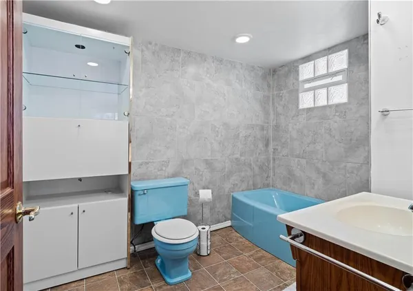 a bathroom with a sink and a bathtub