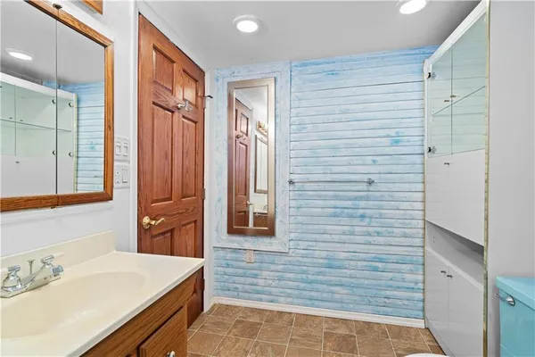 a view of staircase with white walls and a window