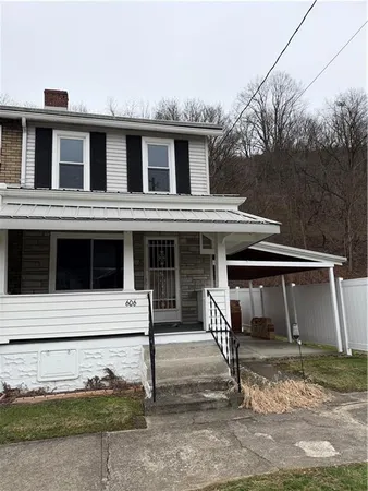 a front view of a house with garage