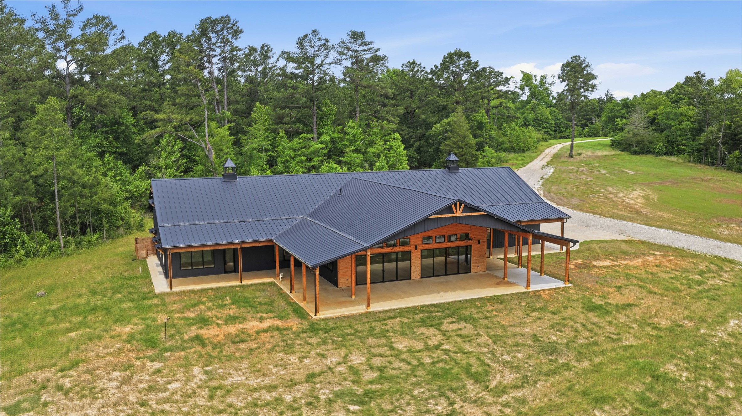 447 County Road 2211 Rusk, TX 75785 - Photo 11 of 50 a house with trees in the background