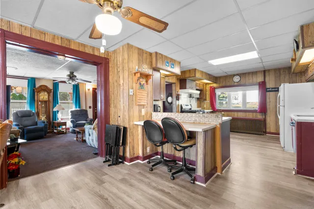 a view of a livingroom with furniture and a gym
