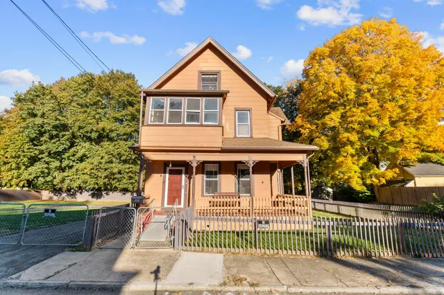 a front view of a house with a porch