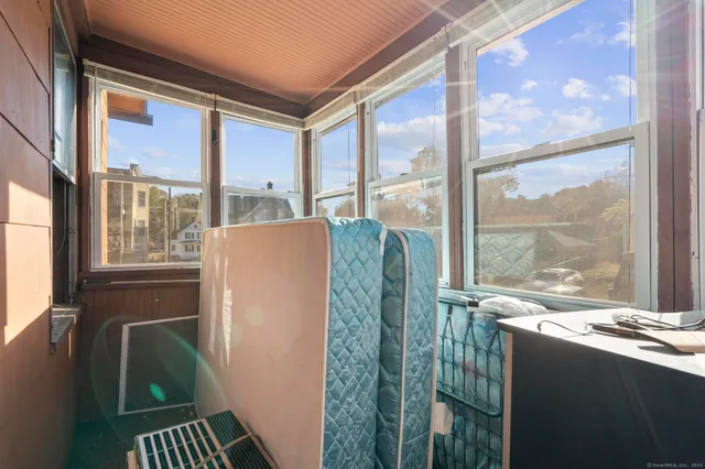 a bed sitting in front of a window