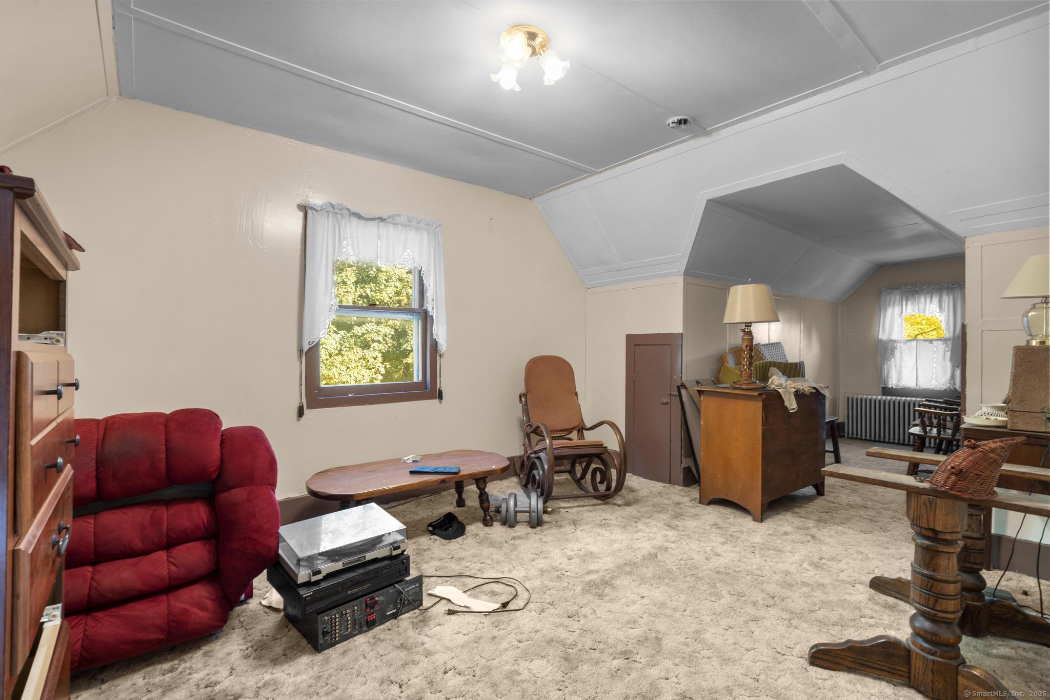 13 French Street Ansonia, CT 06401 - Photo 29 of 40 a living room with furniture gym equipment and a window