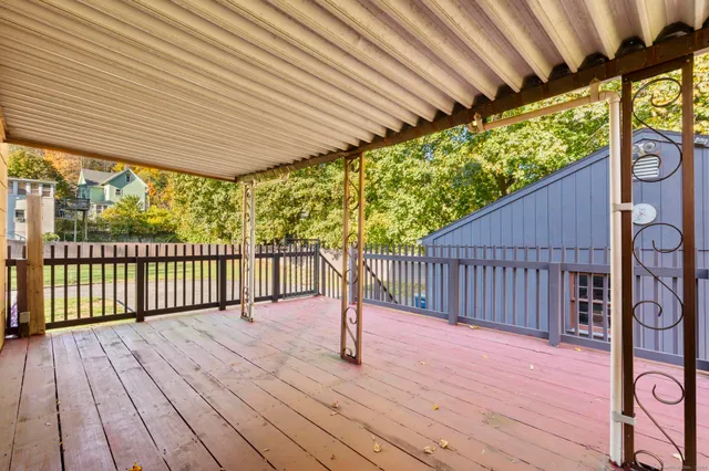 a porch with wooden floor in outdoor space