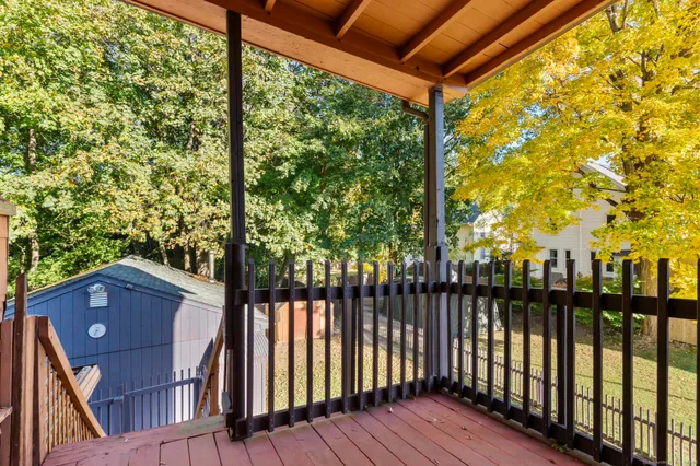 a view of a chairs and table in the balcony