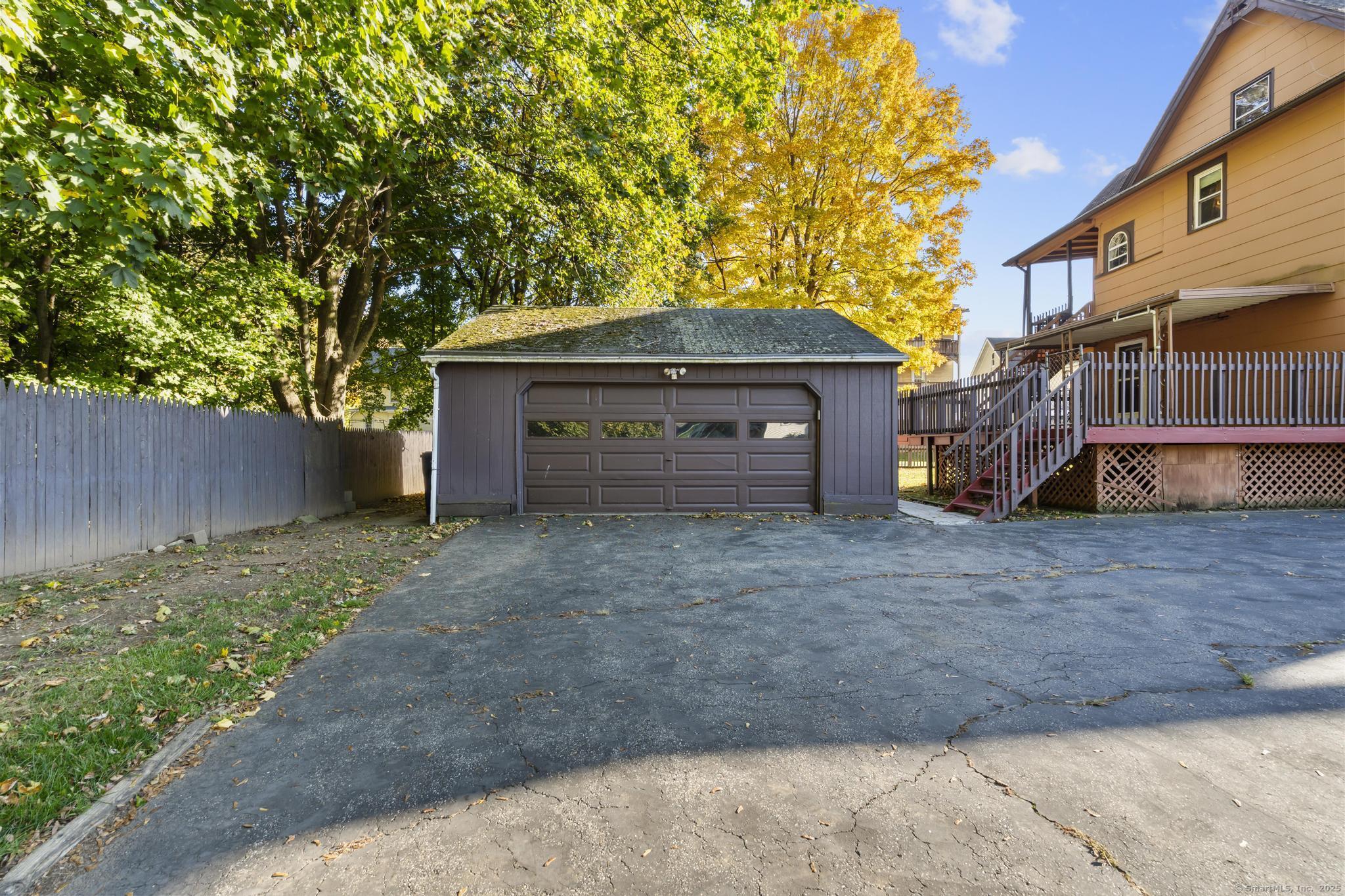 13 French Street Ansonia, CT 06401 - Photo 35 of 40 a front view of a house with a yard and garage