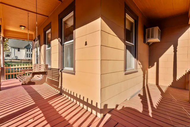 a view of a balcony with wooden floor