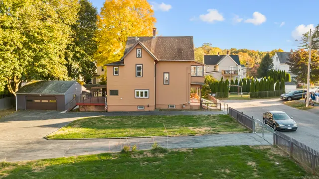 a view of swimming pool with a yard and sitting area