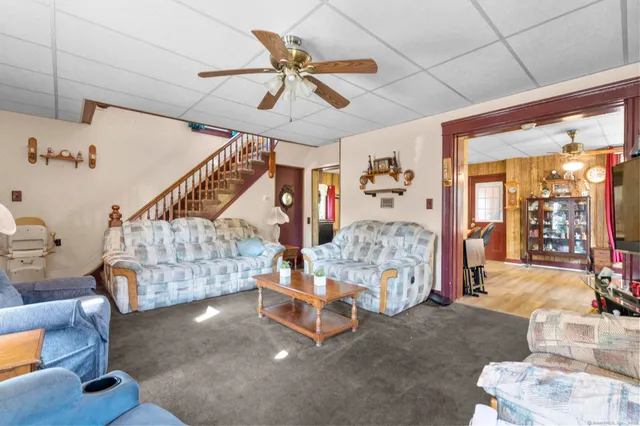 a bedroom with furniture and a chandelier