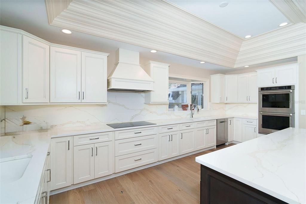 9299 Southwest Lipe Road Arcadia, FL 34269 - Photo 13 of 68 a kitchen with white cabinets sink and white stainless steel appliances