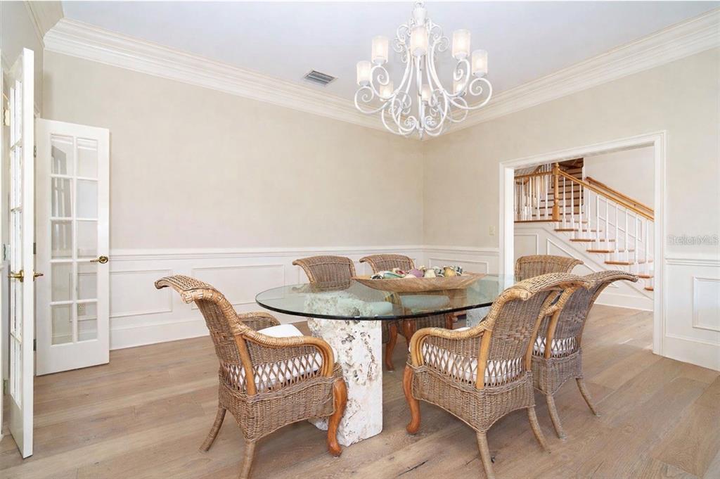 9299 Southwest Lipe Road Arcadia, FL 34269 - Photo 16 of 68 a view of a dining room with furniture and chandelier