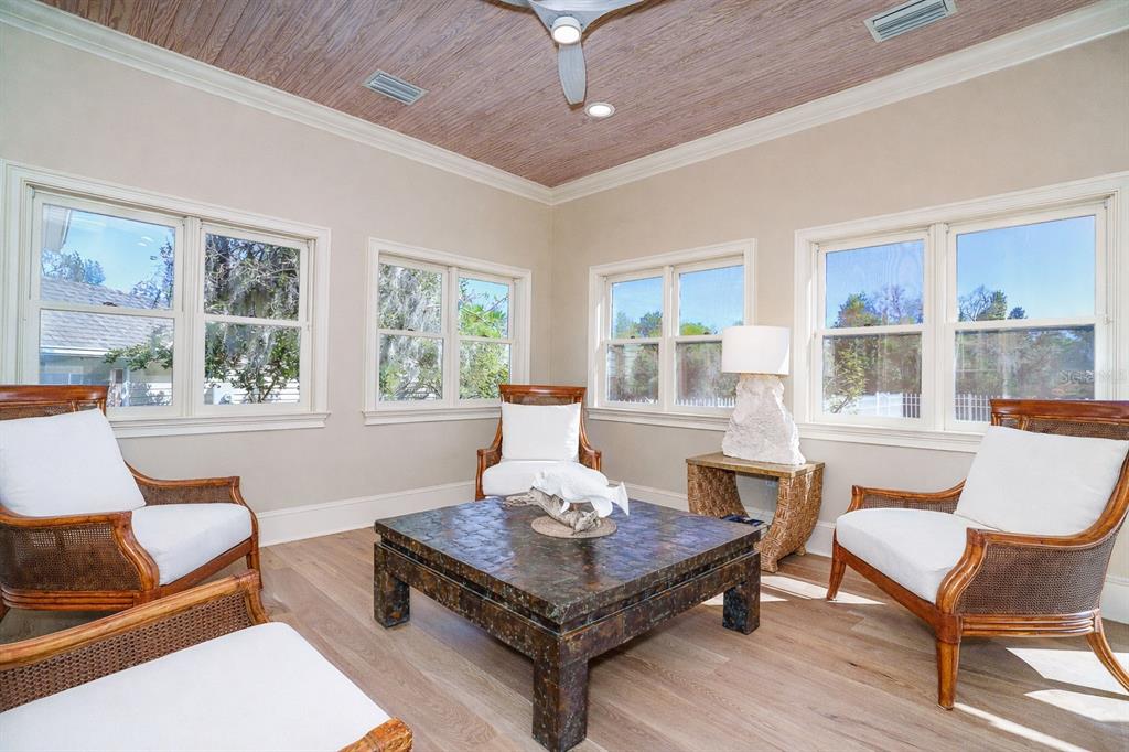 9299 Southwest Lipe Road Arcadia, FL 34269 - Photo 20 of 68 a living room with furniture a rug and a large window