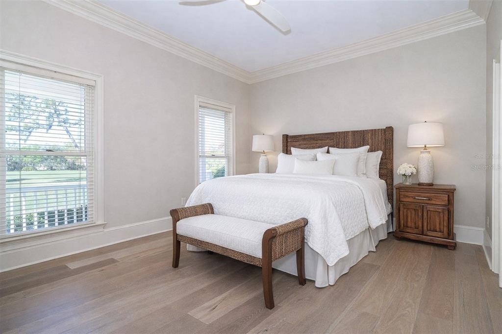 9299 Southwest Lipe Road Arcadia, FL 34269 - Photo 24 of 68 a bedroom with a bed lamp and a large window