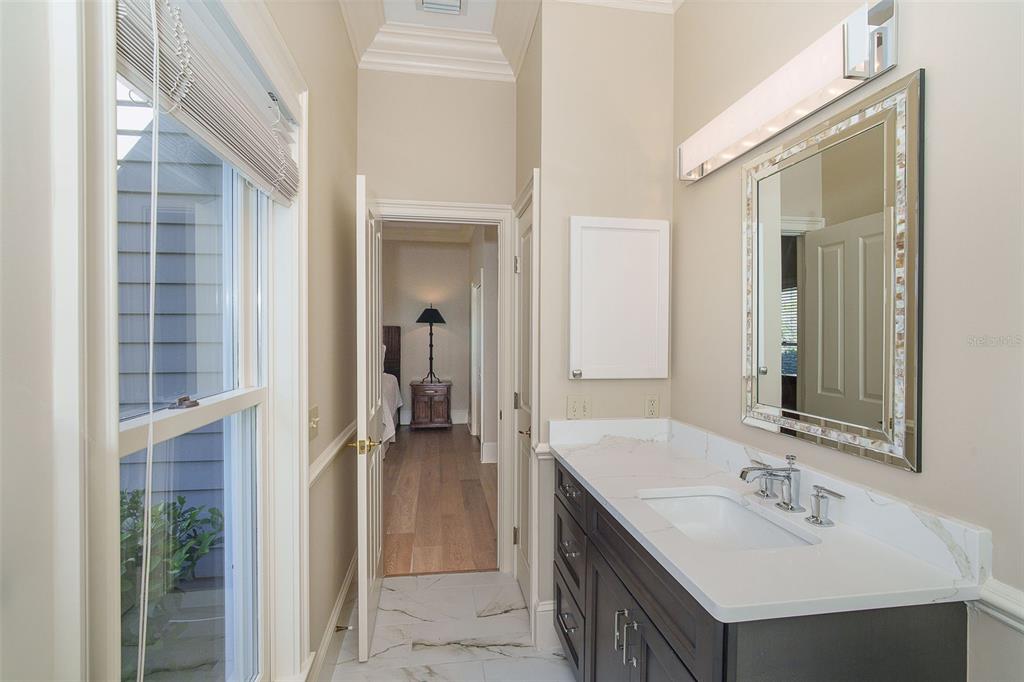 9299 Southwest Lipe Road Arcadia, FL 34269 - Photo 26 of 68 a bathroom with a sink and a mirror