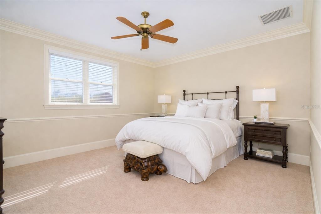 9299 Southwest Lipe Road Arcadia, FL 34269 - Photo 27 of 68 a bed sitting in a bedroom next to a window