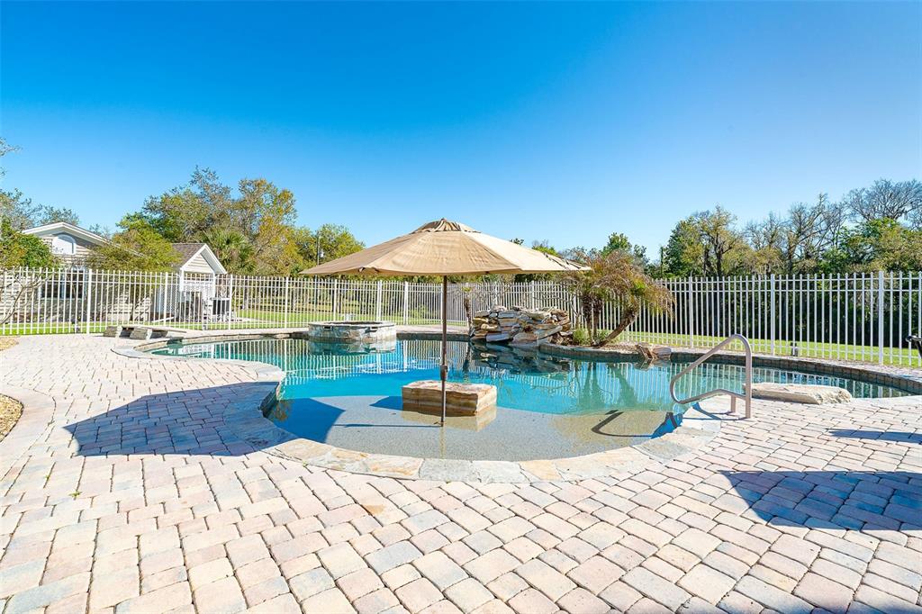 9299 Southwest Lipe Road Arcadia, FL 34269 - Photo 35 of 68 a swimming pool with barbeque oven table and chairs