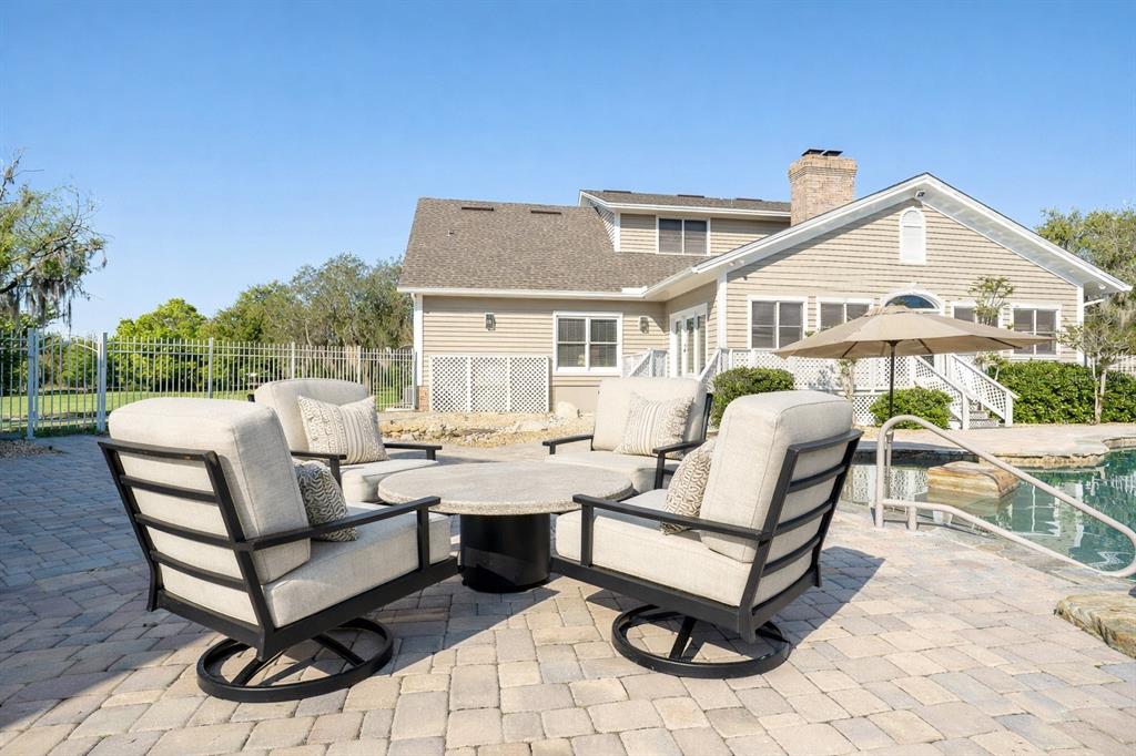 9299 Southwest Lipe Road Arcadia, FL 34269 - Photo 35 of 68 a view of a patio with a table and chairs