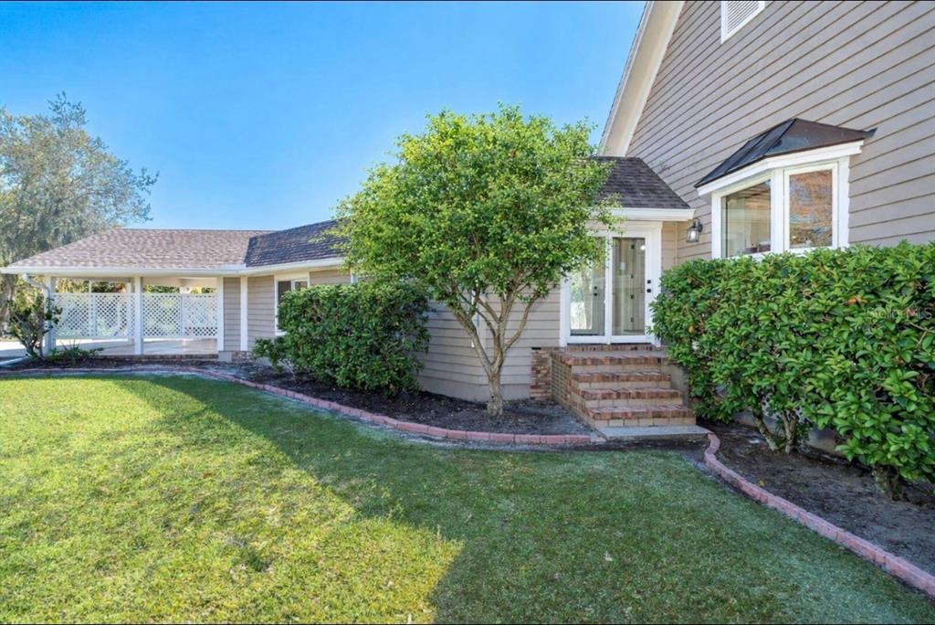 9299 Southwest Lipe Road Arcadia, FL 34269 - Photo 37 of 68 a front view of a house with a yard table and chairs