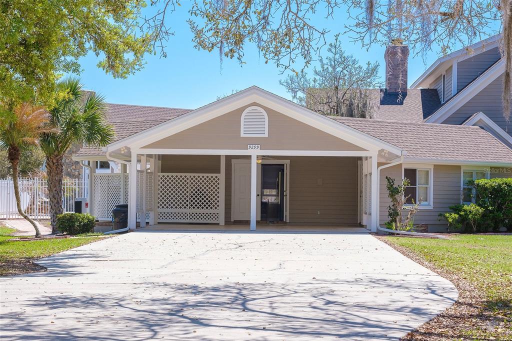9299 Southwest Lipe Road Arcadia, FL 34269 - Photo 40 of 68 a front view of a house with a yard and potted plants