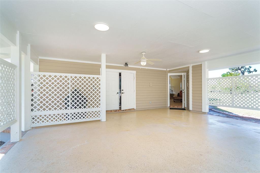 9299 Southwest Lipe Road Arcadia, FL 34269 - Photo 40 of 68 an empty room with wooden floor and windows