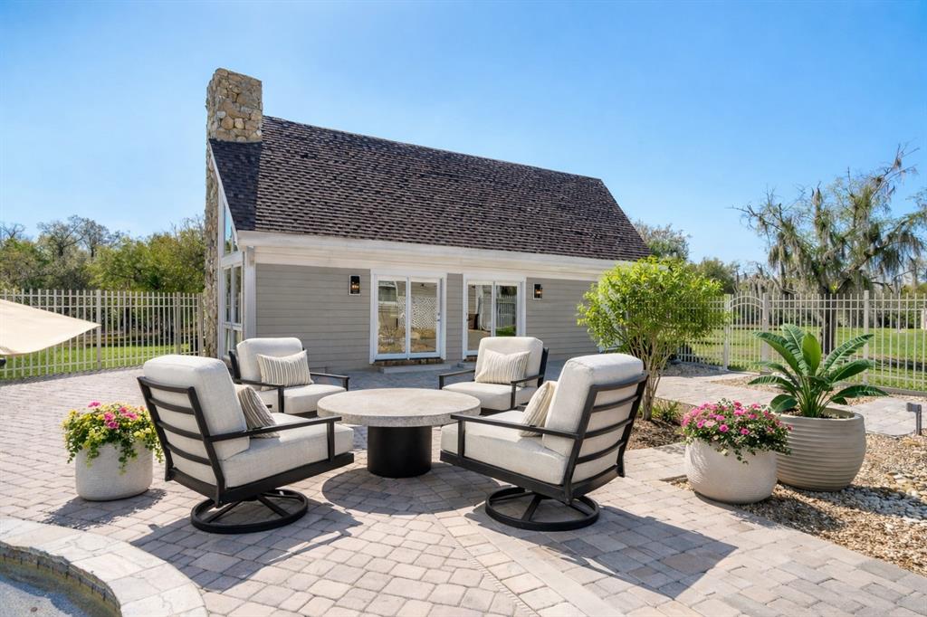 9299 Southwest Lipe Road Arcadia, FL 34269 - Photo 42 of 68 a view of a patio with couches and potted plants