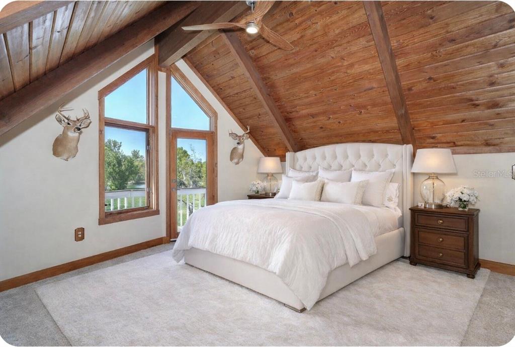 9299 Southwest Lipe Road Arcadia, FL 34269 - Photo 46 of 68 a bedroom with a bed and a window