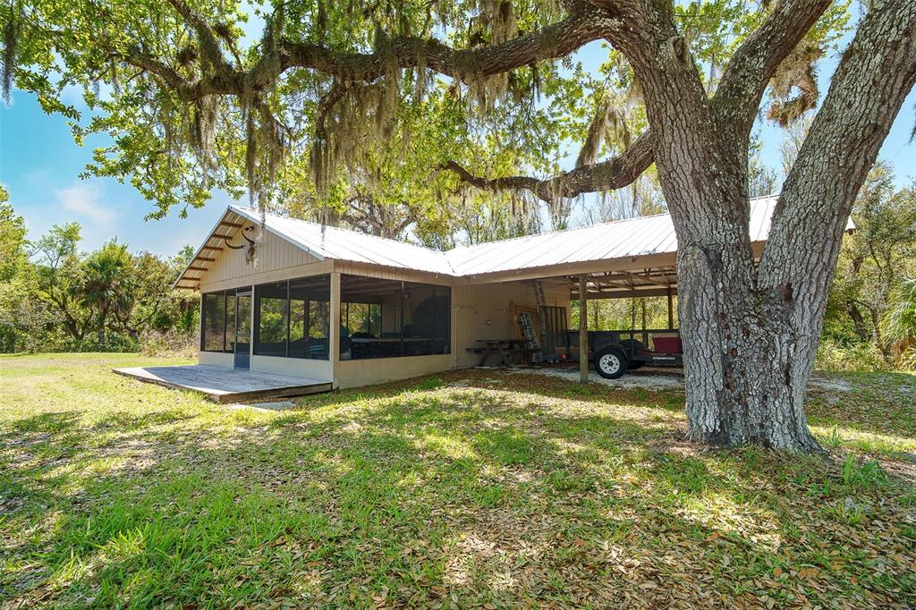 9299 Southwest Lipe Road Arcadia, FL 34269 - Photo 56 of 68 a view of a house with a yard