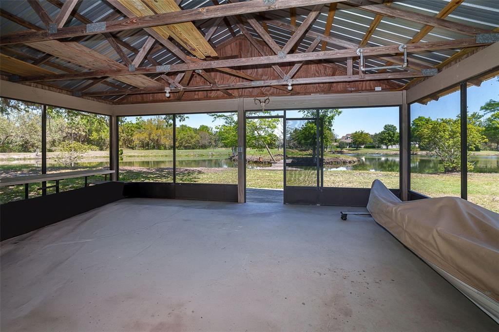 9299 Southwest Lipe Road Arcadia, FL 34269 - Photo 56 of 68 a view of a room with wooden walls