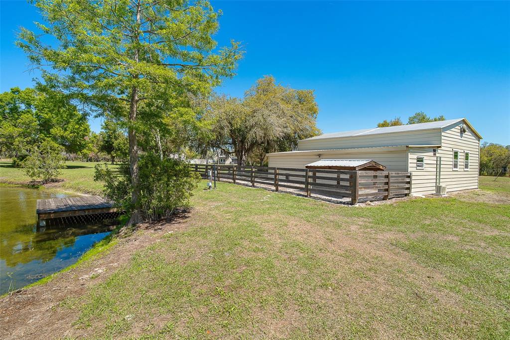 9299 Southwest Lipe Road Arcadia, FL 34269 - Photo 58 of 68 a front view of a house with a garden