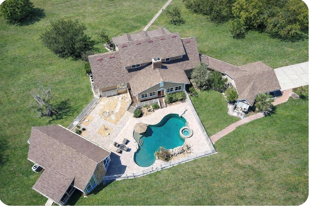 9299 Southwest Lipe Road Arcadia, FL 34269 - Photo 63 of 68 an aerial view of a house with a yard and trees