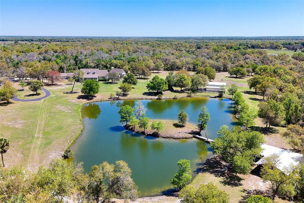 9299 Southwest Lipe Road Arcadia, FL 34269 - Photo 66 of 68 a view of a lake with boats and trees all around
