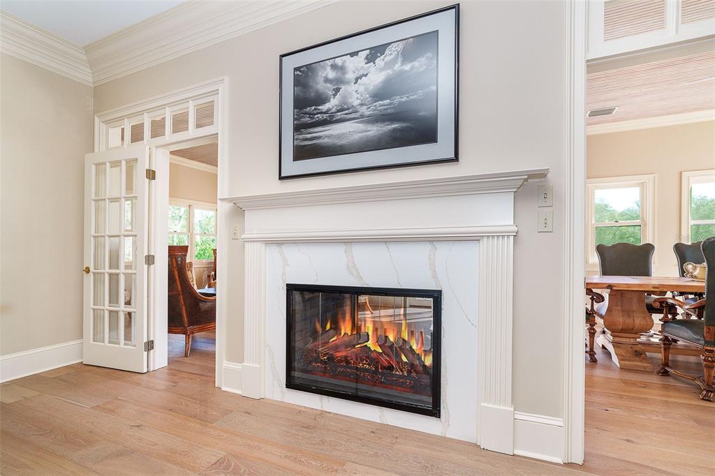 9299 Southwest Lipe Road Arcadia, FL 34269 - Photo 9 of 68 a view of a livingroom with a fireplace and workspace