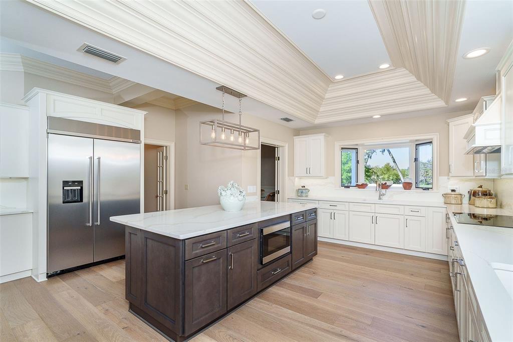 9299 Southwest Lipe Road Arcadia, FL 34269 - Photo 10 of 68 a large kitchen with stainless steel appliances granite countertop a stove a sink dishwasher and a refrigerator