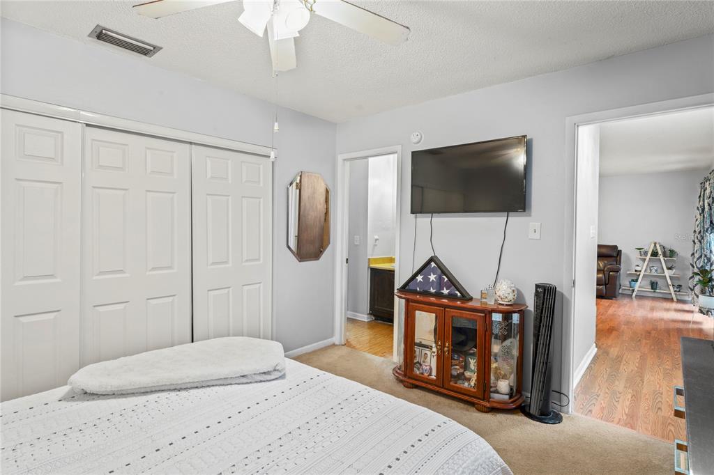 802 Antler Court Brandon, FL 33511 - Photo 12 of 37 a bedroom with furniture and a flat screen tv